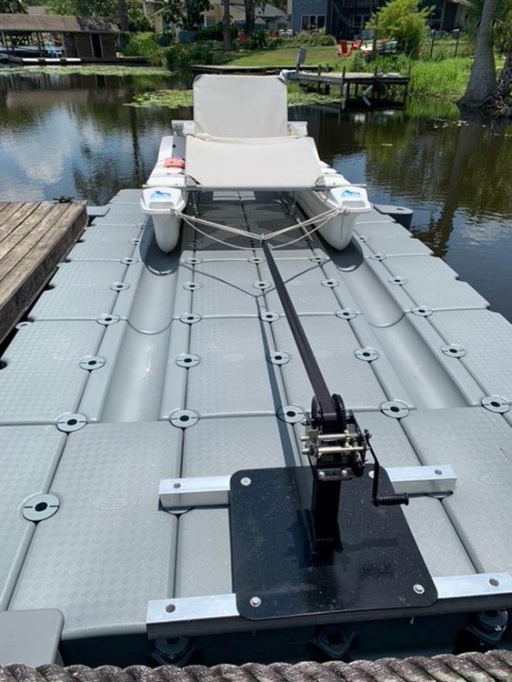 Catamaran on floating boat dock