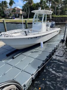 24 foot everglades bay boat on floating boat dock