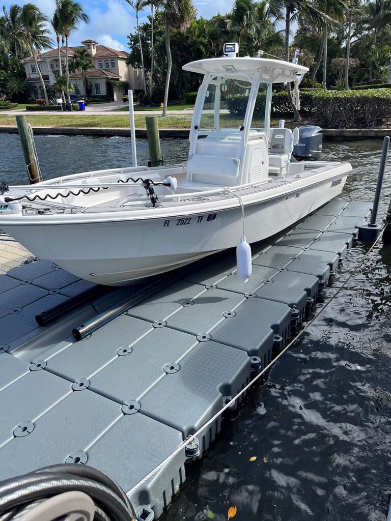 24 foot everglades bay boat on floating boat dock